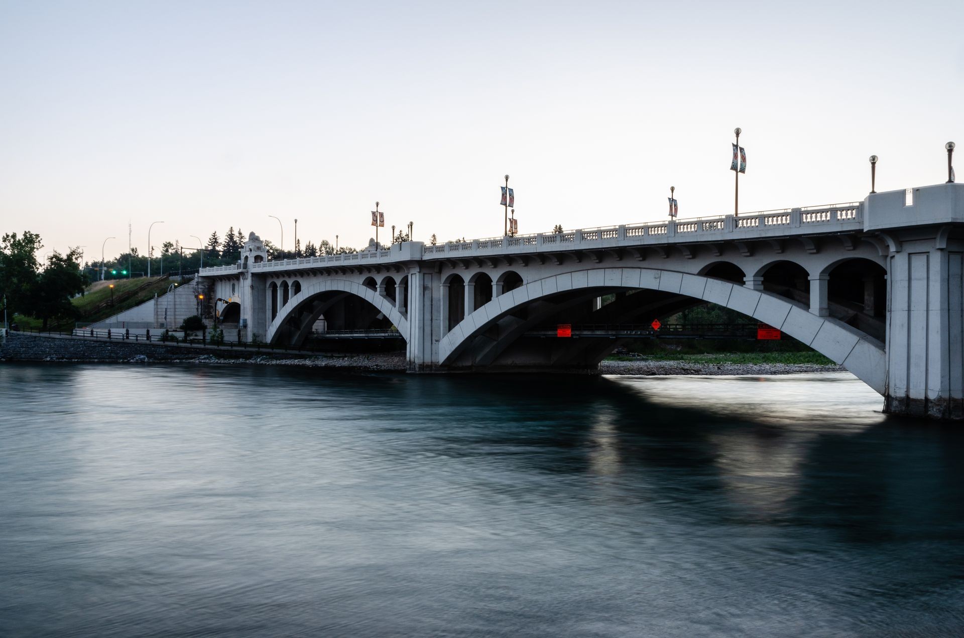 Long exposure of Centre Street Bridge over Bow River in Calgary, Alberta, Canada on the morning of 28th July 2018